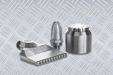 Three Silvent air nozzles, 973, 209 L and 710 on a grey industrial background.
