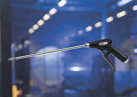 A SILVENT Pro One air blow gun with an extension pipe, on a blue industrial background.